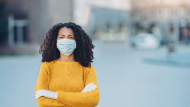 Woman wearing mask and gloves