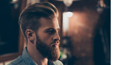 Man with groomed beard with backlight