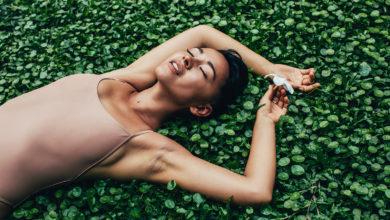 woman lying relaxed in a field of plants