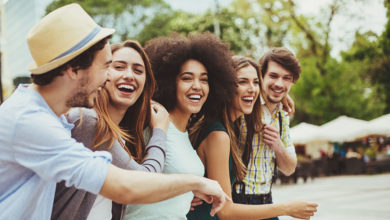 A row of friends smiling and laughing