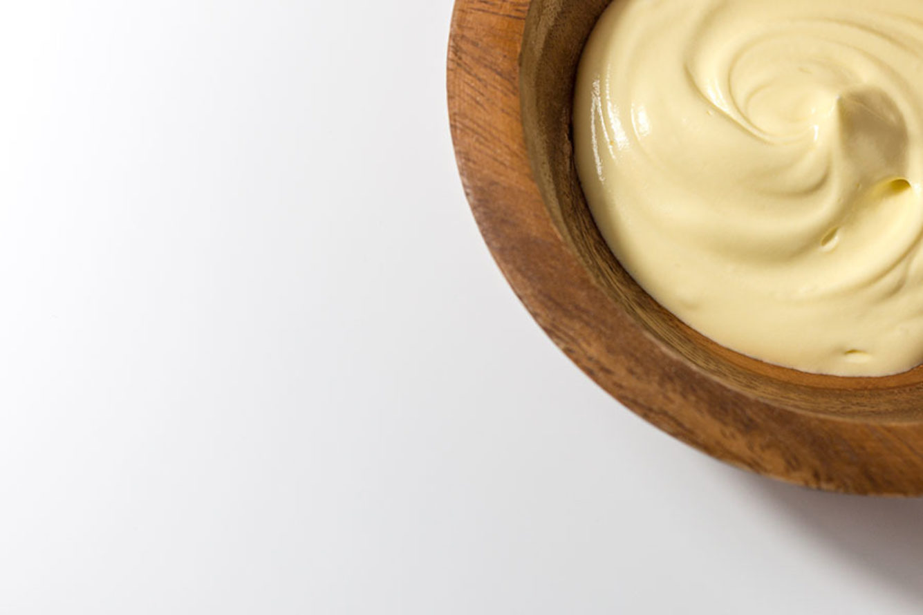 Close up of whipped butter in wooden bowl